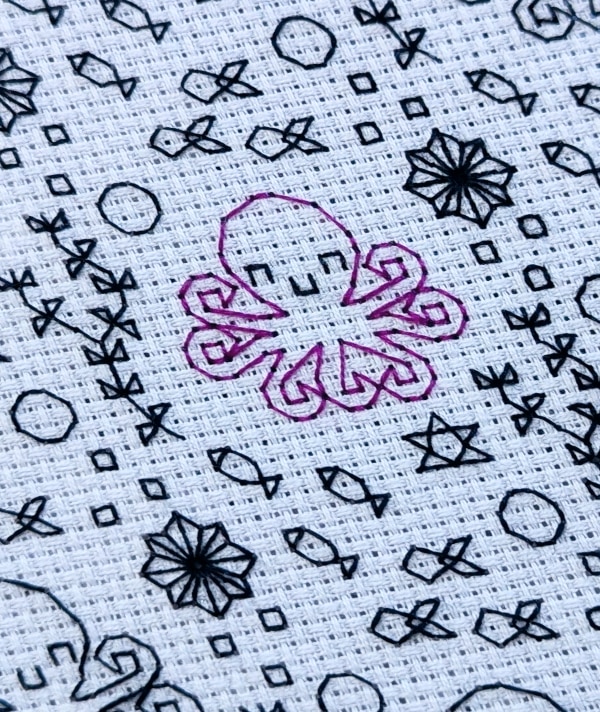 Close up of a happy octopus stitched embroidery pattern