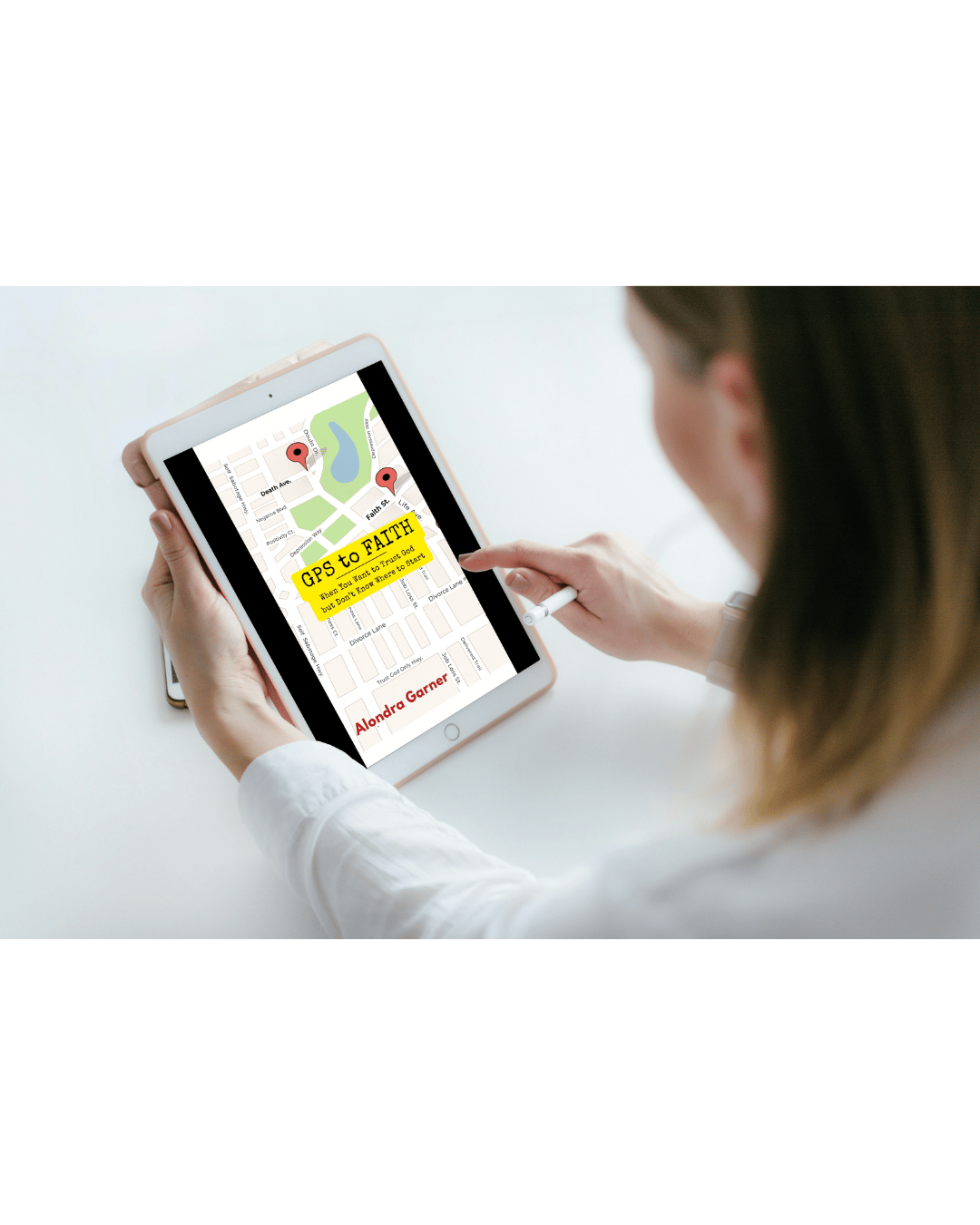 Woman reading the faith-based eBook GPS to Faith on a tablet. The digital book cover features a GPS map theme for spiritual growth and trusting God during uncertain times.