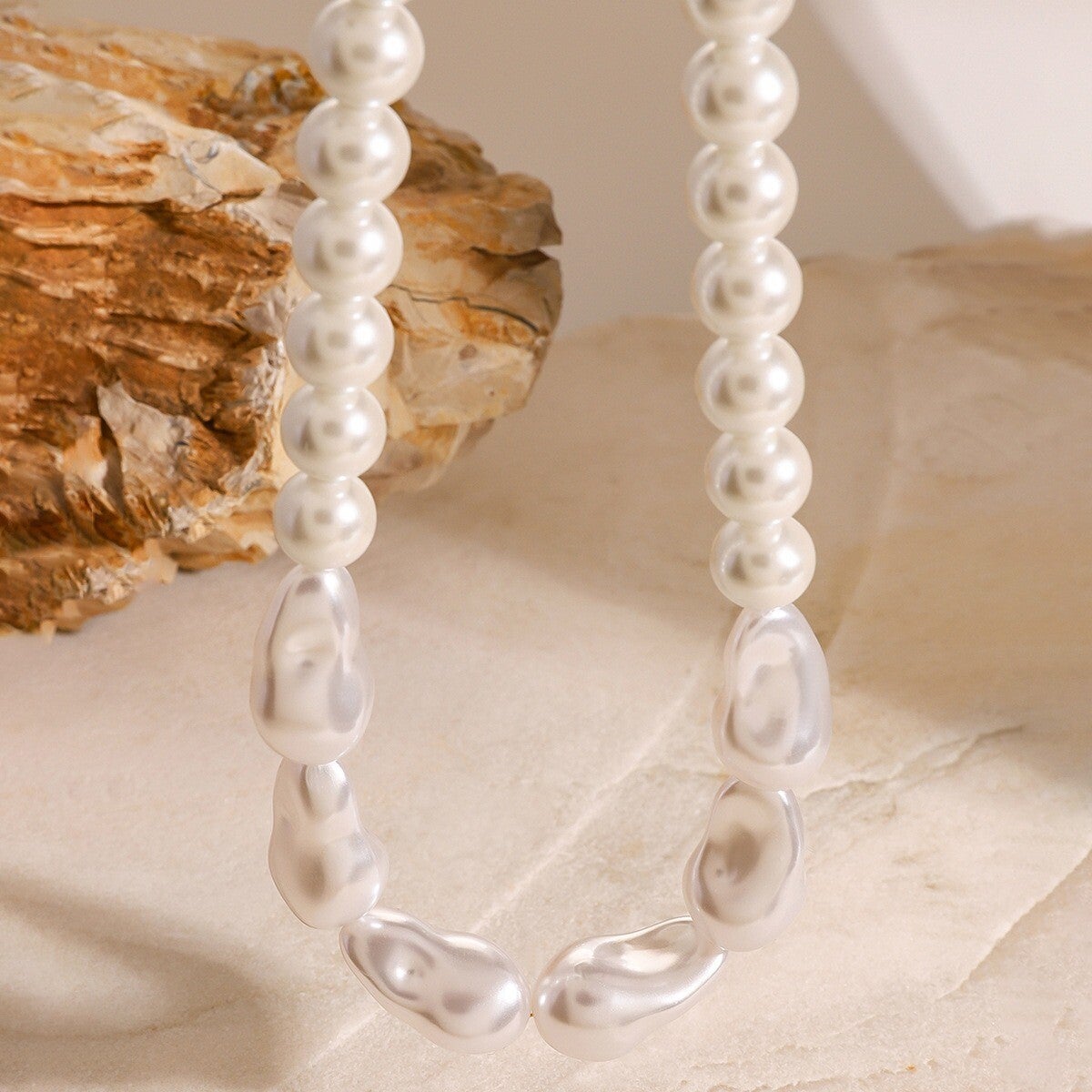 Modern irregular pearl necklace with stylish gold detailing