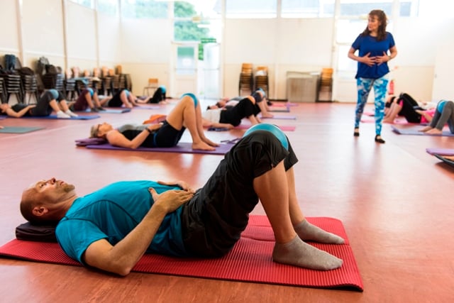 teaching a mat Pilates class