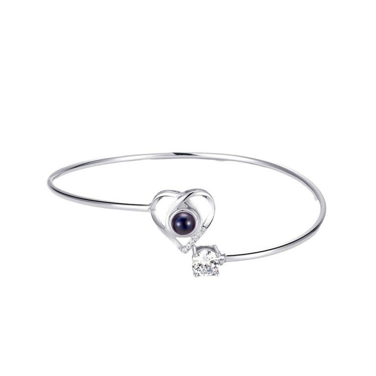 Custom photo bracelet with heart charm and sleek metal bangle