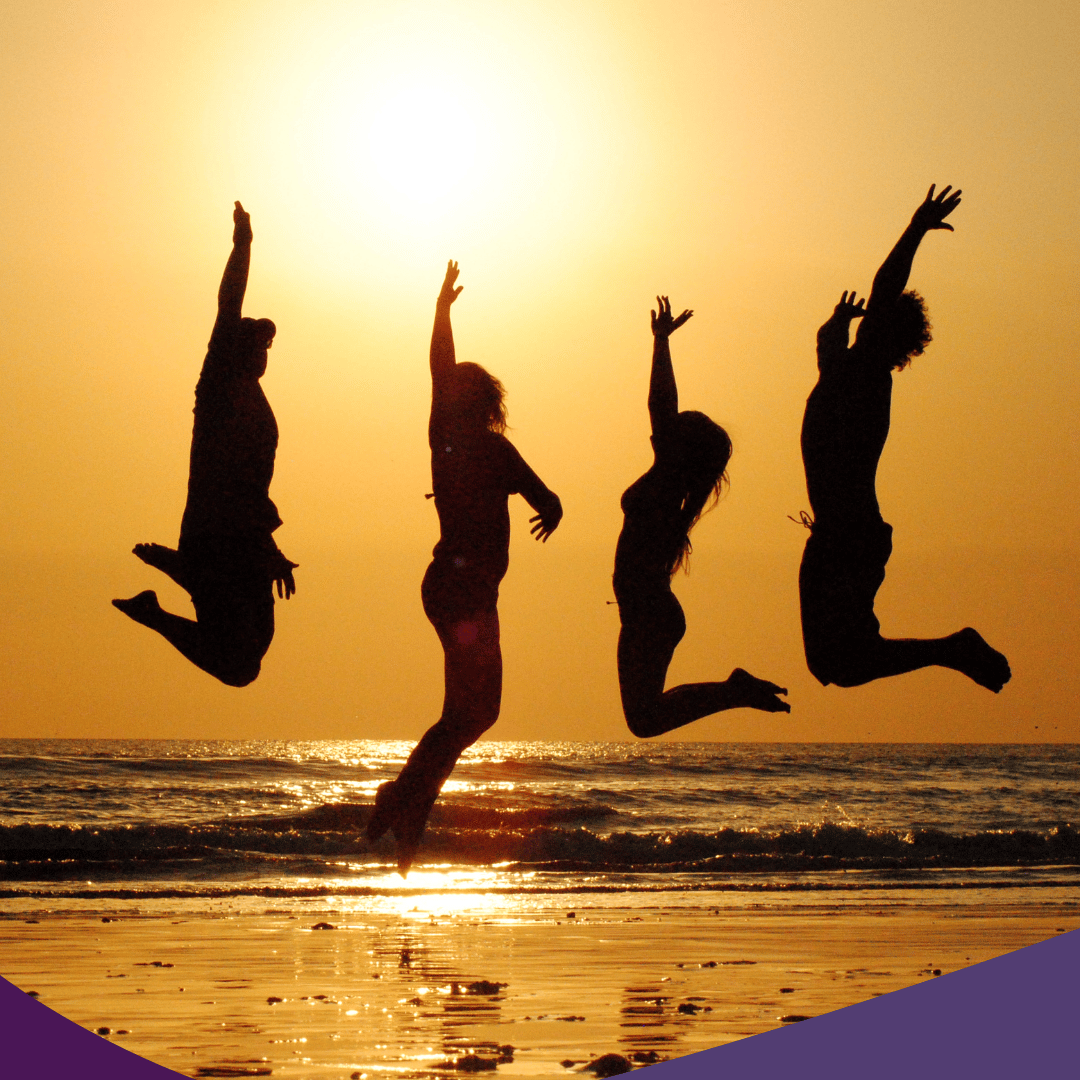 People jumping on beach