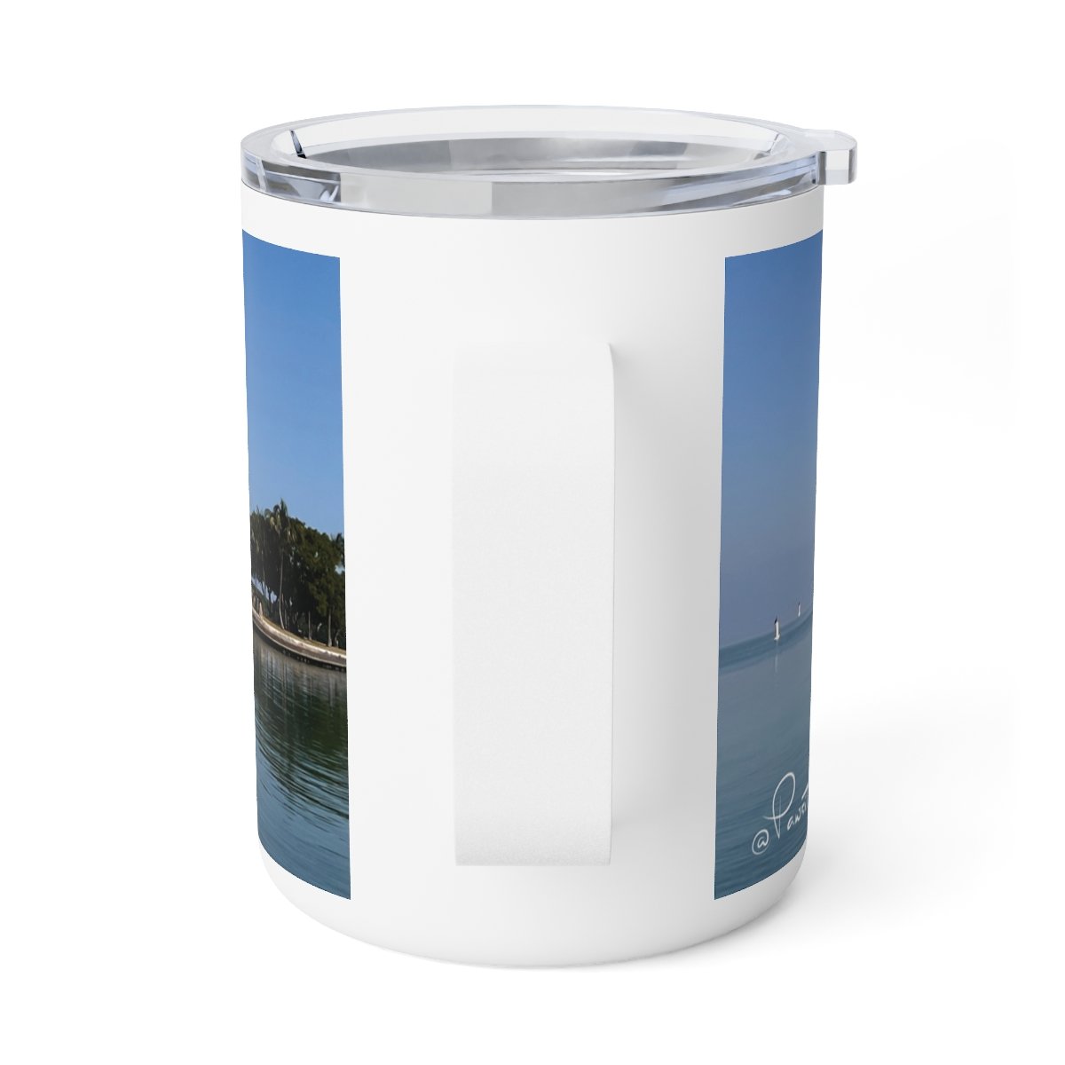“Front view of insulated stainless steel mug featuring a warm Miami sunrise over the water.”