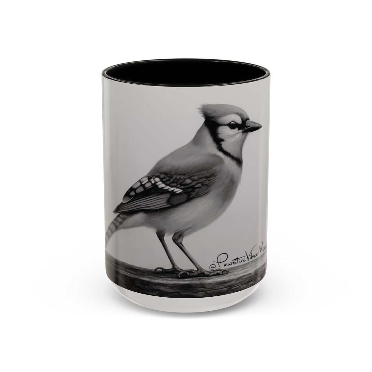 “Front view of ceramic mug featuring a realistic blue jay perched in stillness.”