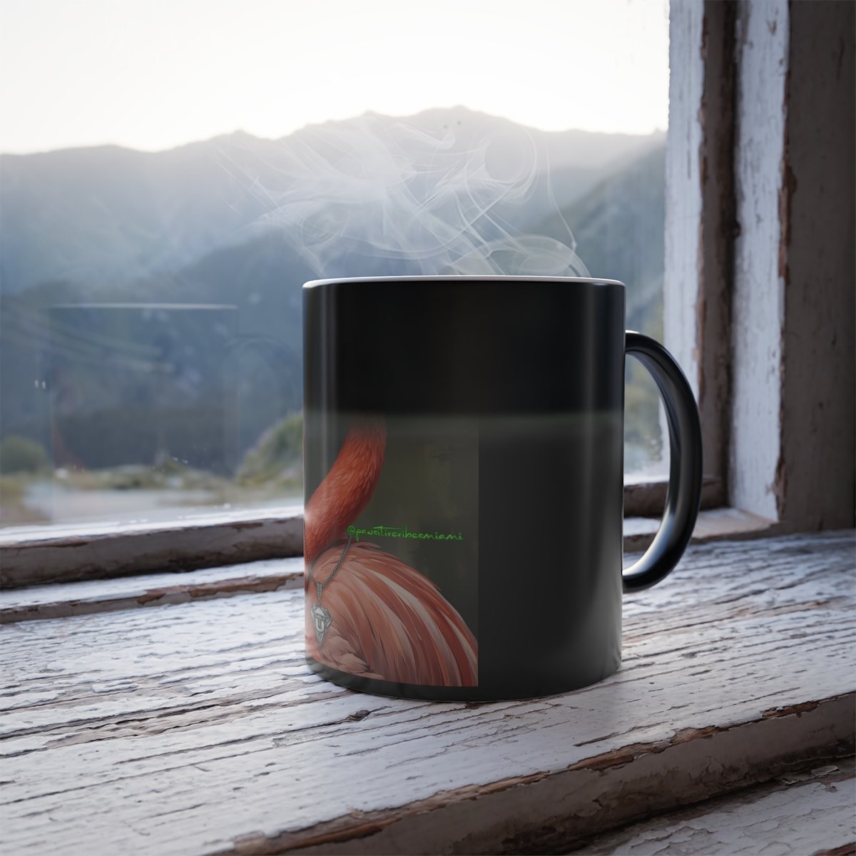 “Angled view of flamingo surrounded by swirling aura colors on heat‑reveal mug.”