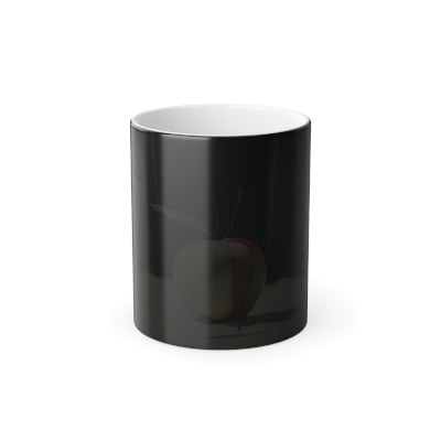 “Glossy black mug showing angelic halo illustration revealed by heat.”