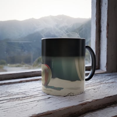 “Front view of color‑changing mug revealing angelic halo artwork in soft glowing tones when hot.”