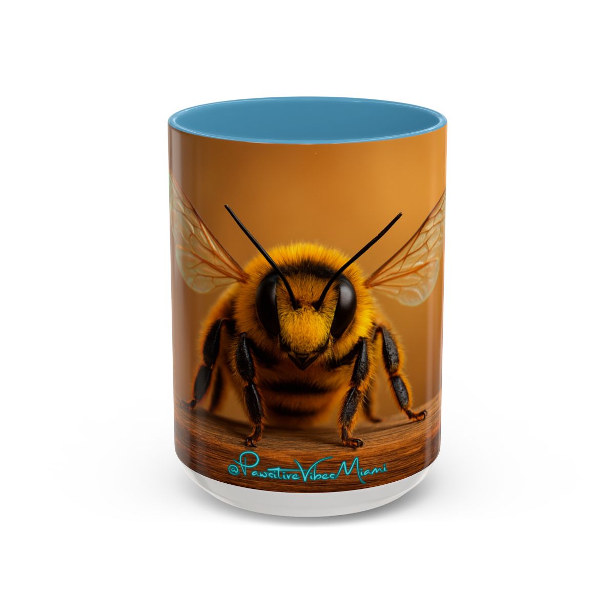 “Full‑wrap bee artwork with warm, radiant colors on a glossy ceramic mug.”