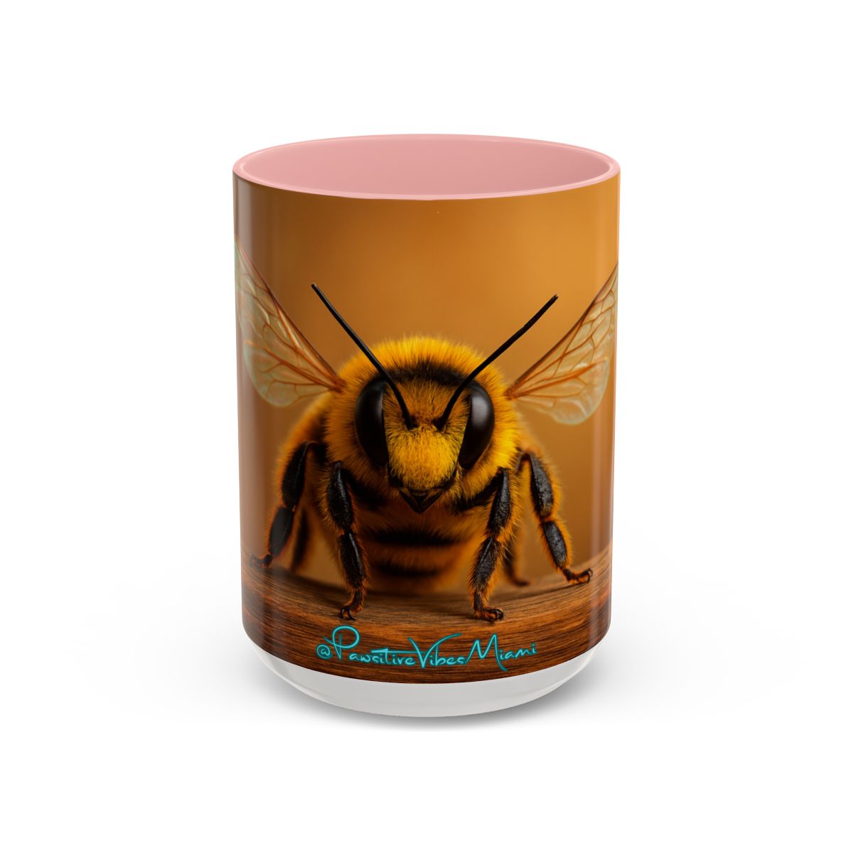 “Bee illustration with soft wing details printed in warm, calming tones on a ceramic mug.”