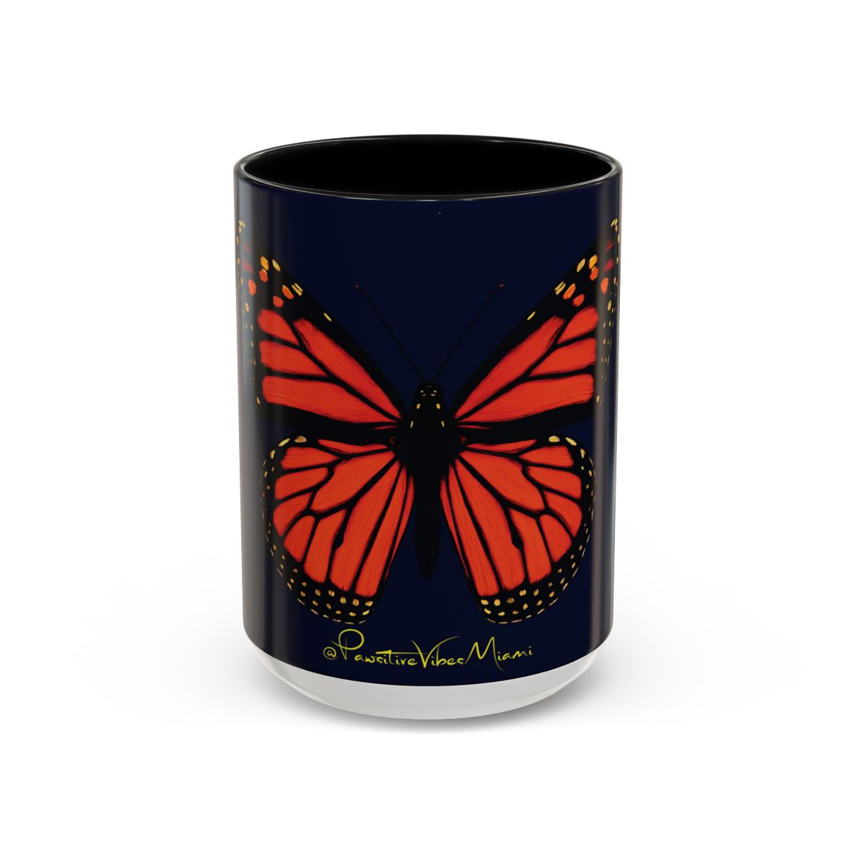 “Front view of glossy ceramic mug featuring a monarch butterfly glowing against a midnight background.”