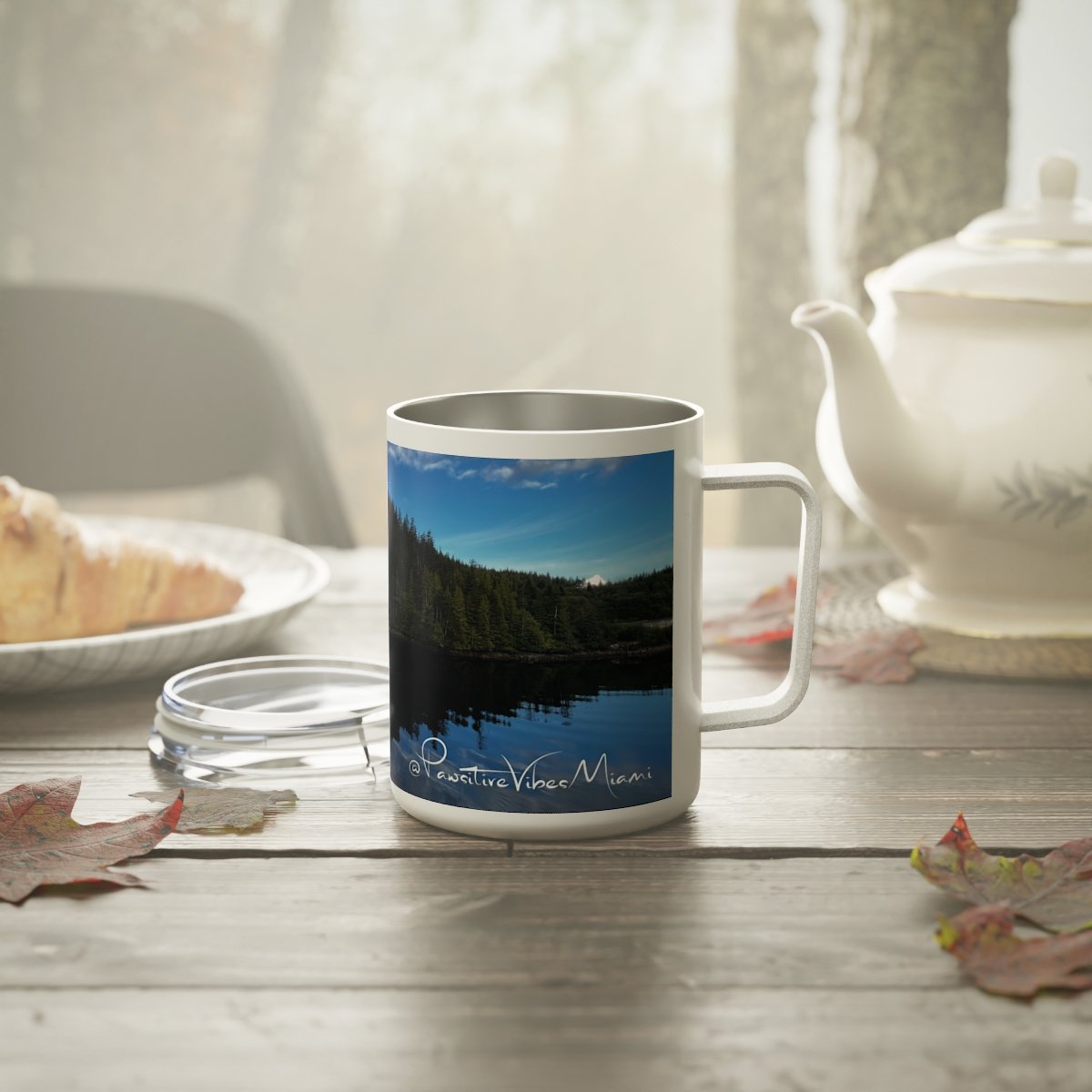 “Alaska island resting in calm water printed on a 10 oz insulated mug with full‑wrap design.”