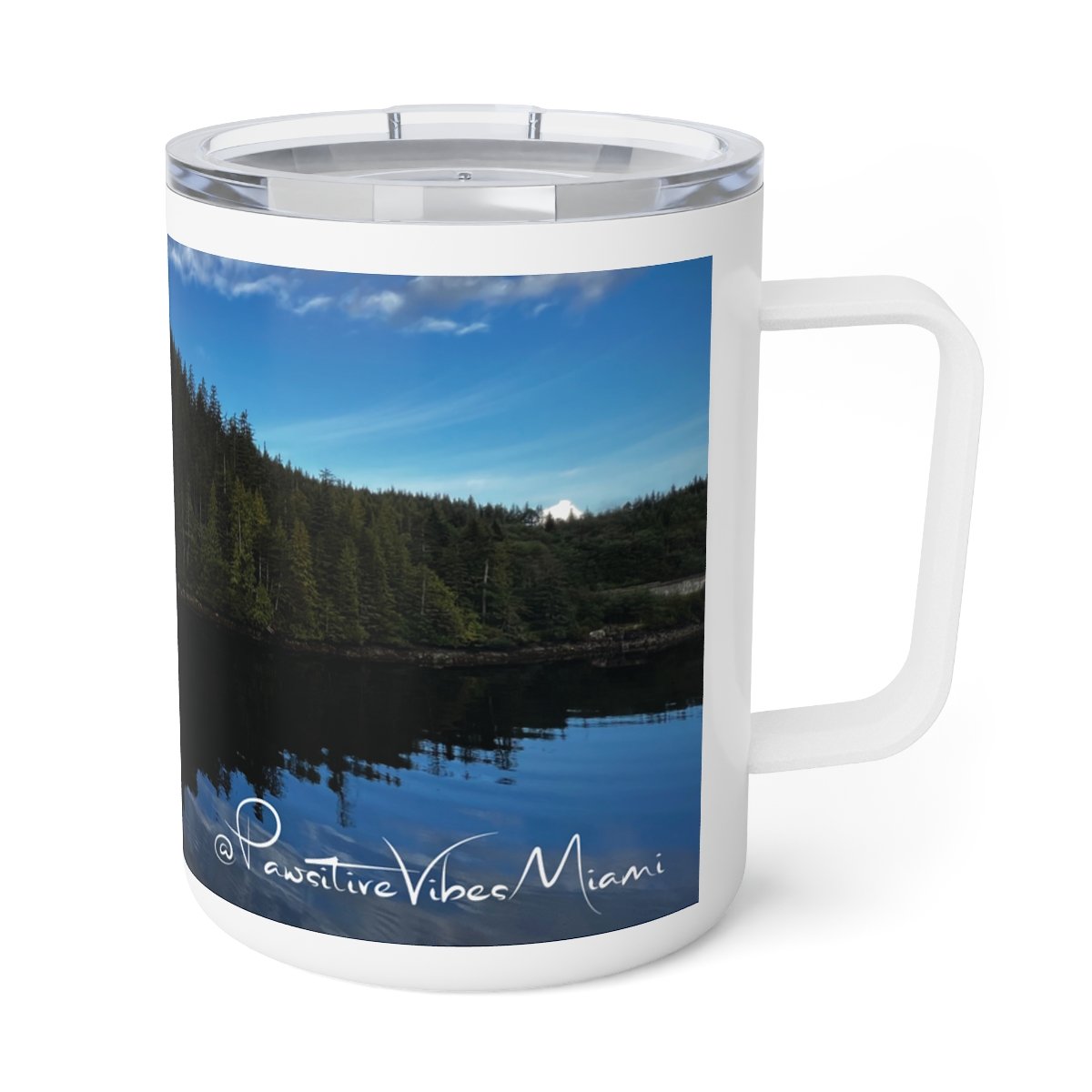 “Stainless‑steel mug wrapped in serene Alaska landscape with mirrored lake reflection.”