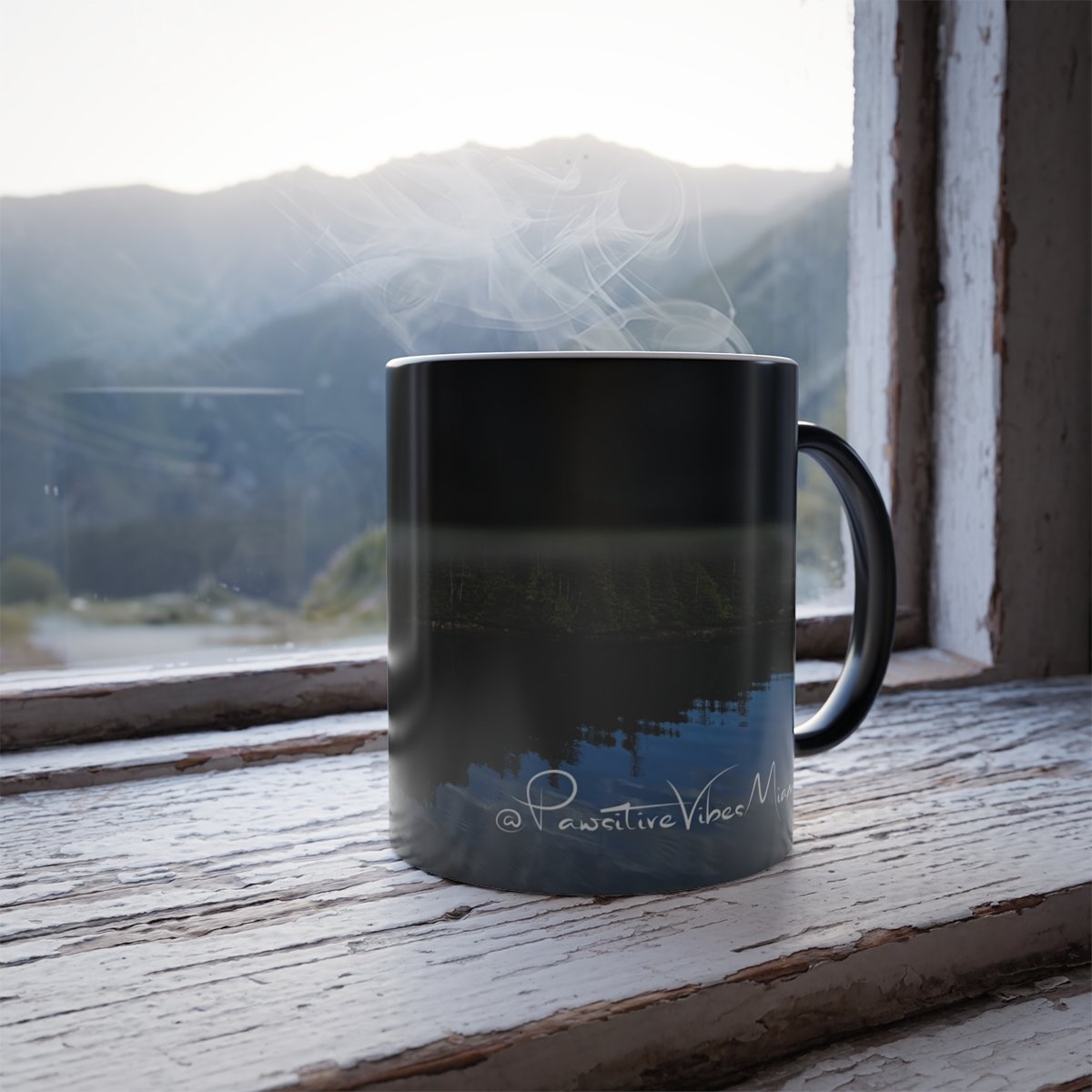 “Alaska island reflection artwork revealed on a color‑morphing mug when hot liquid is added.”