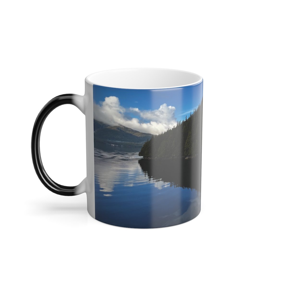 “Color‑changing ceramic mug unveiling a serene Alaska landscape mirrored in still water.”