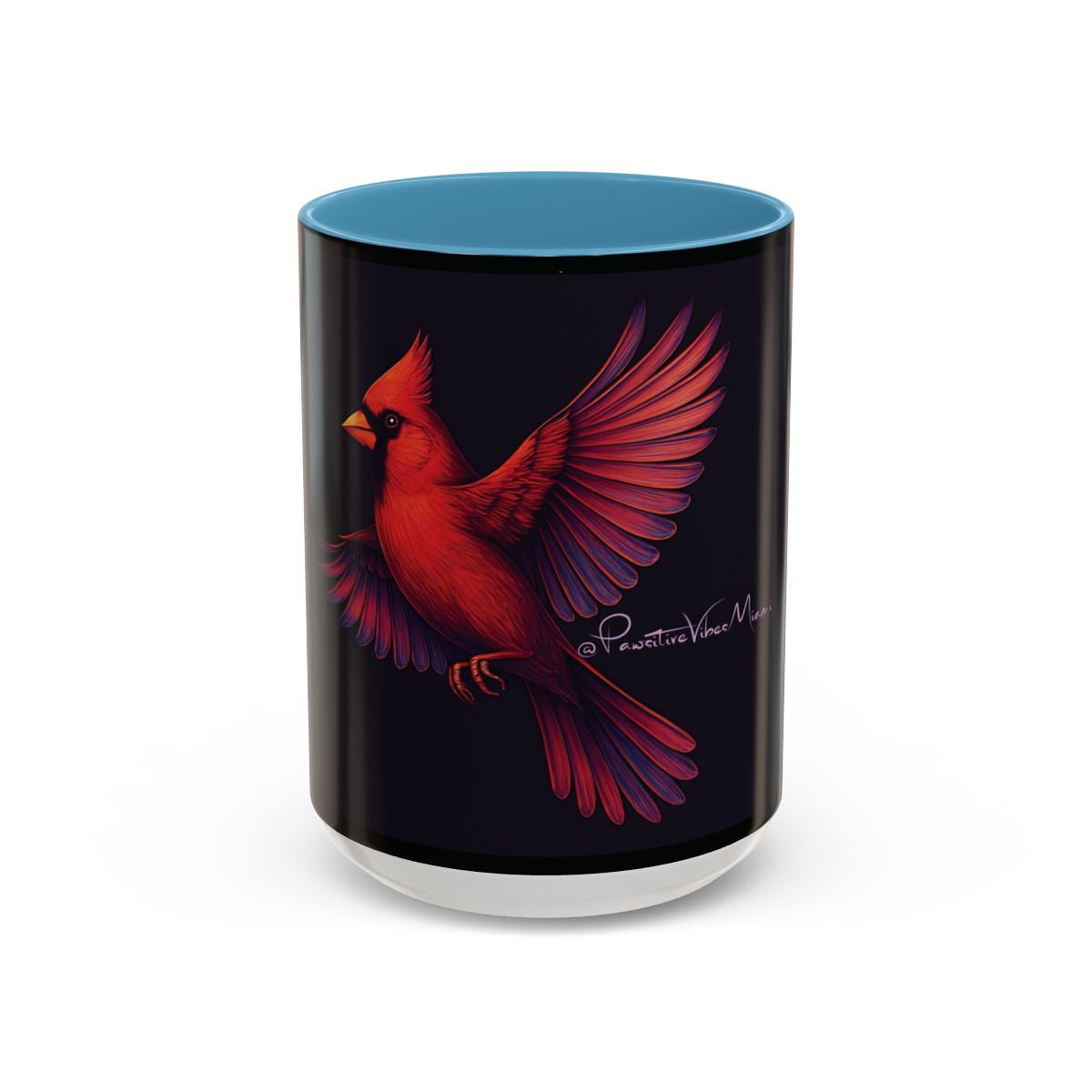 “Light blue ceramic mug with radiant red‑winged cardinal artwork symbolizing spiritual signs.”
