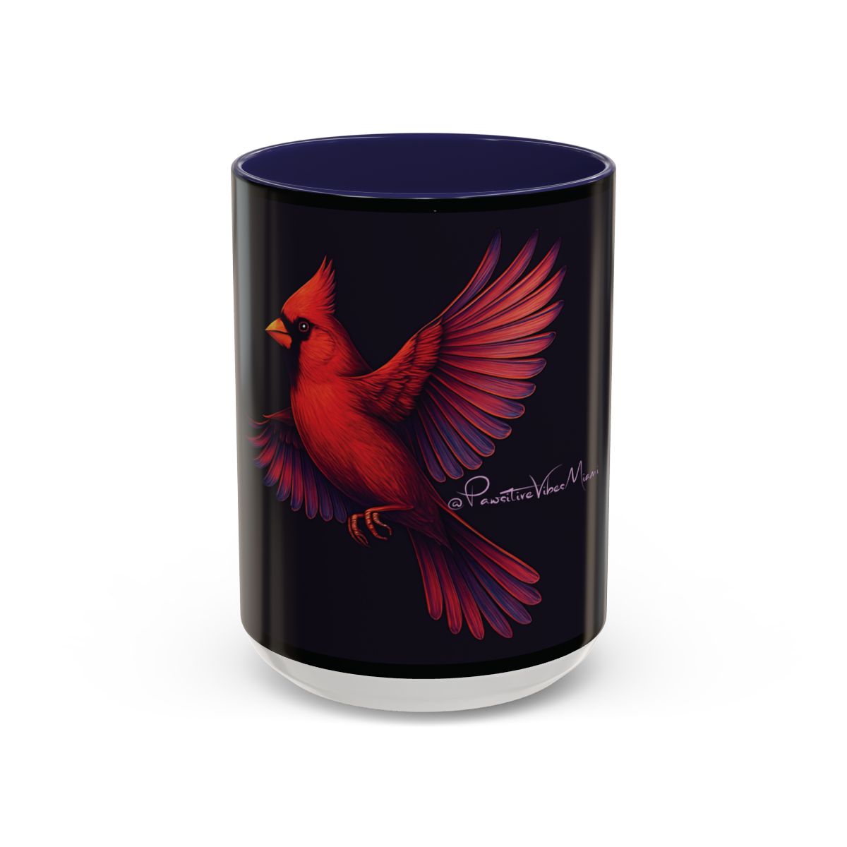 “Navy ceramic mug with luminous red‑winged cardinal artwork symbolizing spiritual presence.”