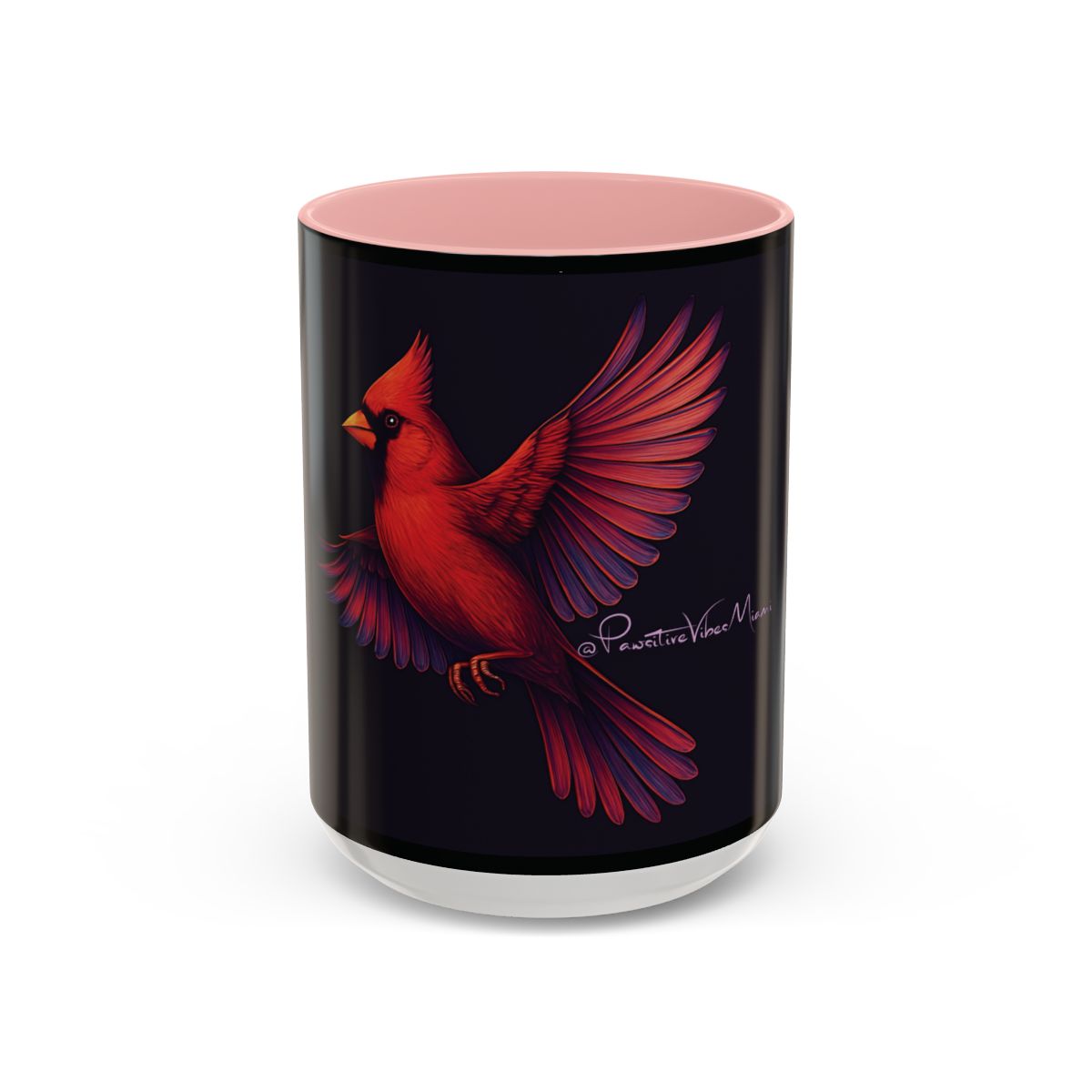 “Pink ceramic mug with luminous red‑winged cardinal artwork symbolizing gentle remembrance.”