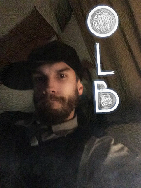 Oregonleatherboy bearded wearing leather hat and sweater vest