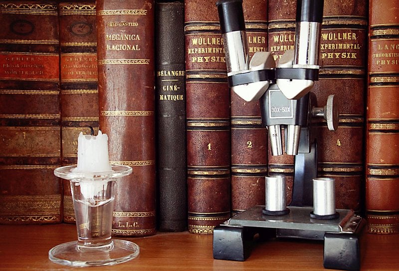 shelf of antique books with leather covers