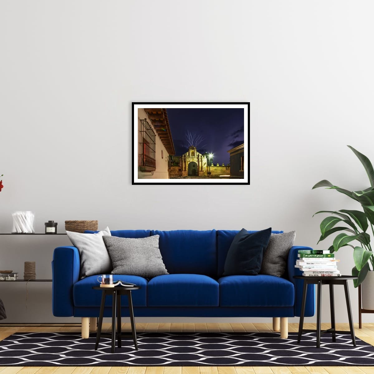 Modern living room interior mockup displaying a framed fine art night print of a lightning strike in Antigua, Guatemala by Tony Reddington.