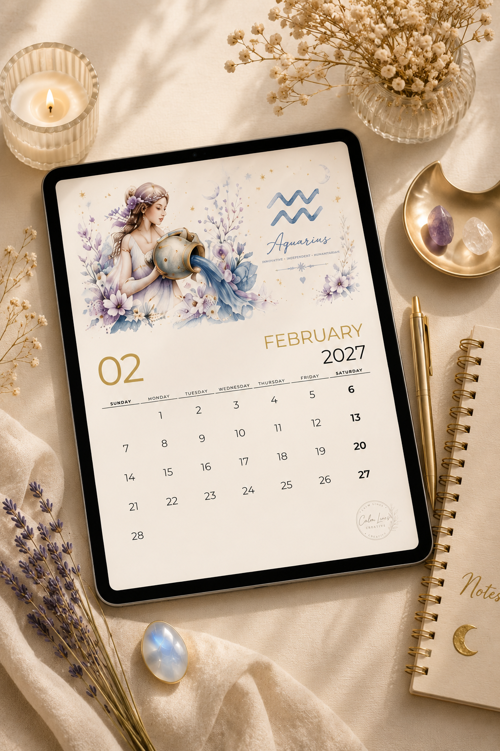 Digital Moon & Stars 2027 zodiac calendar displayed on a tablet with printable monthly planner pages.