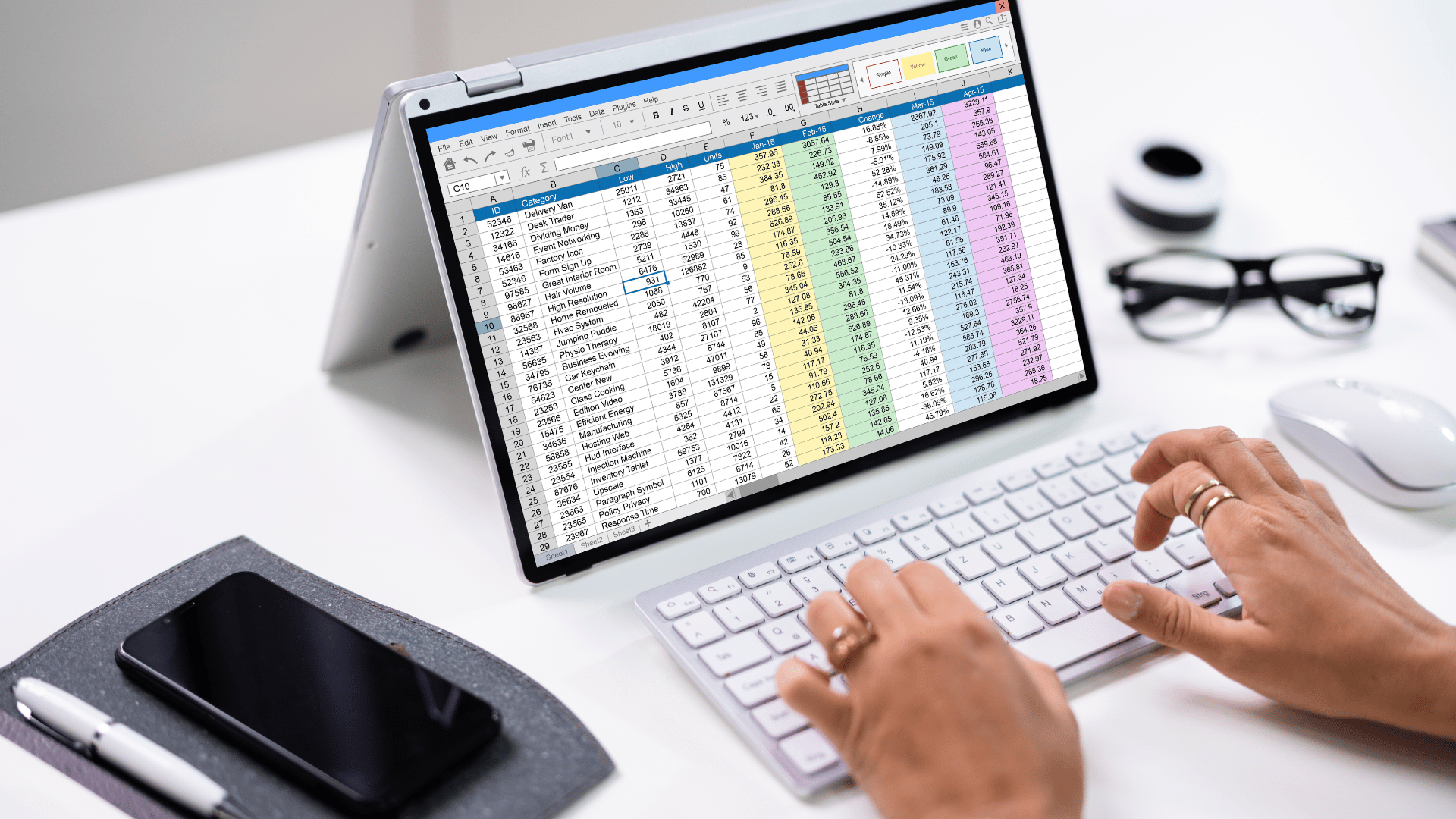 Desk Image with a computer screen with a spreadsheet