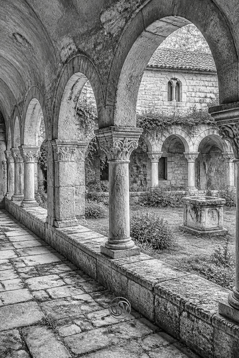 Grayscale coloring page of an ancient monastery cloister with an  arched stone walkway around an overgrown courtyard