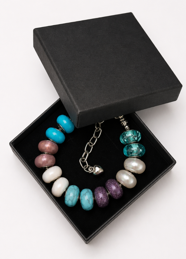 Multicolour European charm bracelet presented in a black jewellery gift box