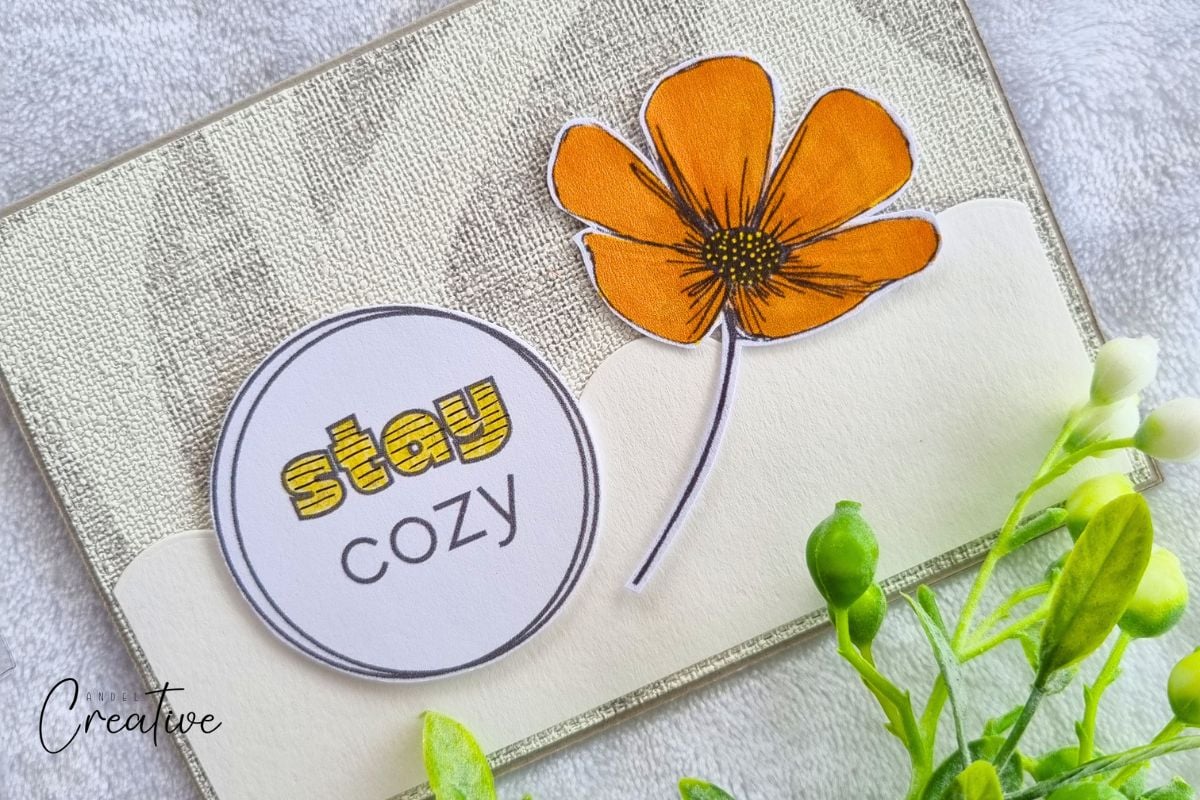 Handmade greeting card with an orange flower and STAY COZY sentiment colored in yellow