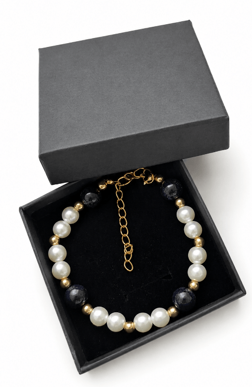 Blue Sandstone and faux pearl bracelet presented in a black jewellery gift box