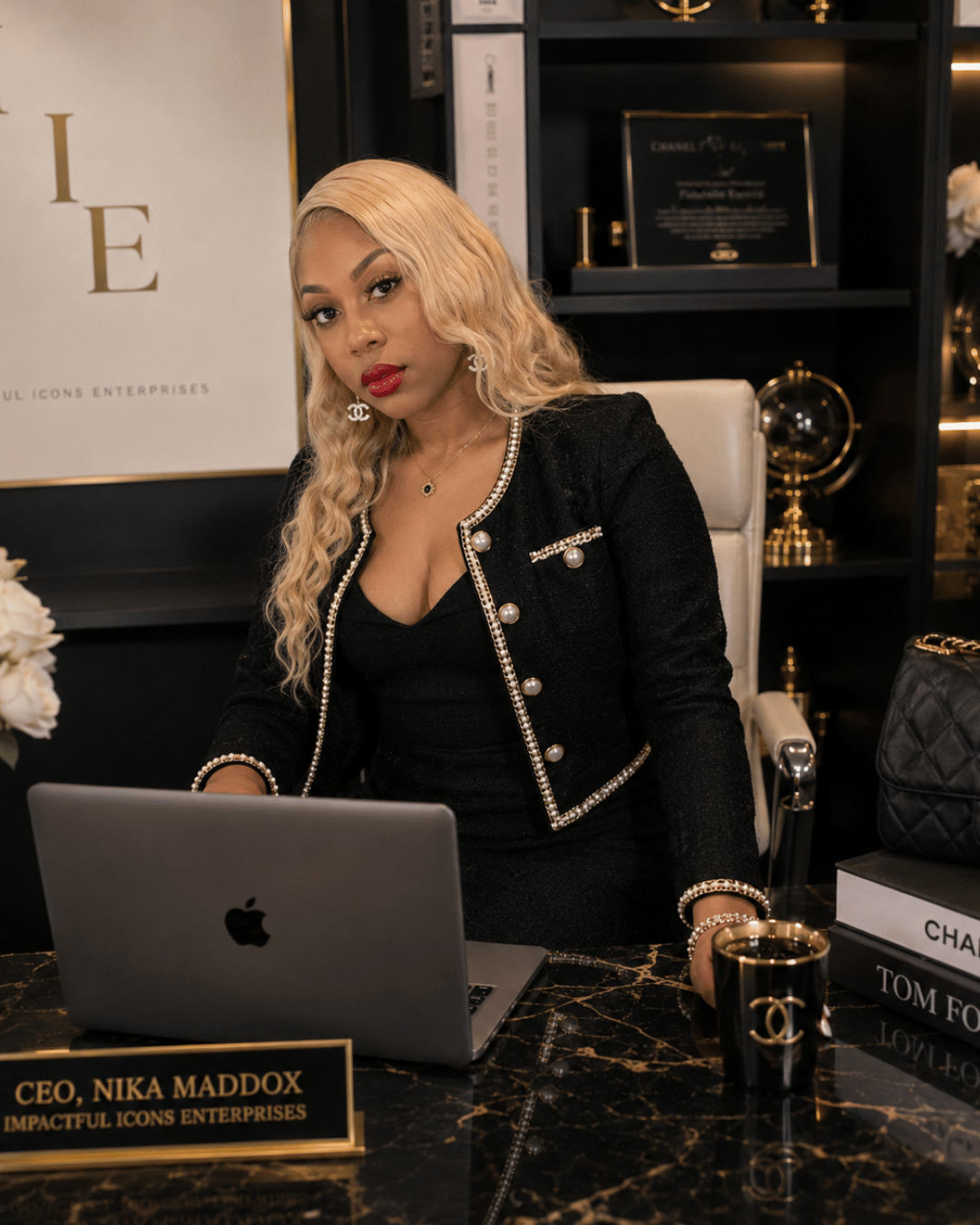 Entrepreneur and business educator at a desk creating Client Conversion School, a practical training program designed to help entrepreneurs attract leads, convert prospects, and gain more paying clients.