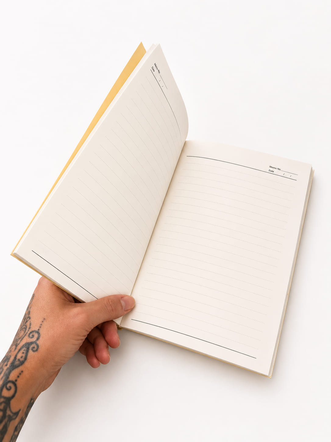 Open yellow A5 lemon notebook showing lined pages for writing, notes and journaling