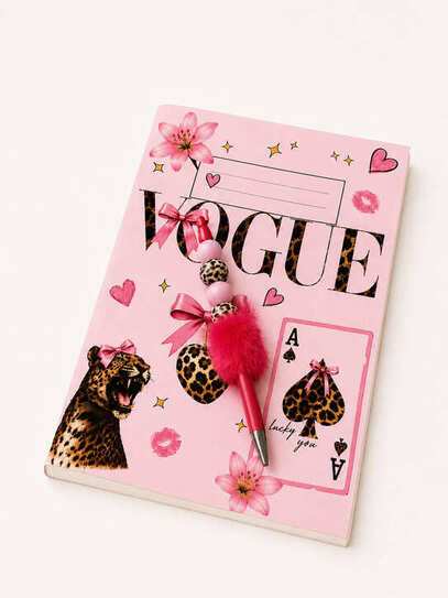 Handmade pink fluffy beaded pen with leopard print beads displayed on matching pink leopard notebook