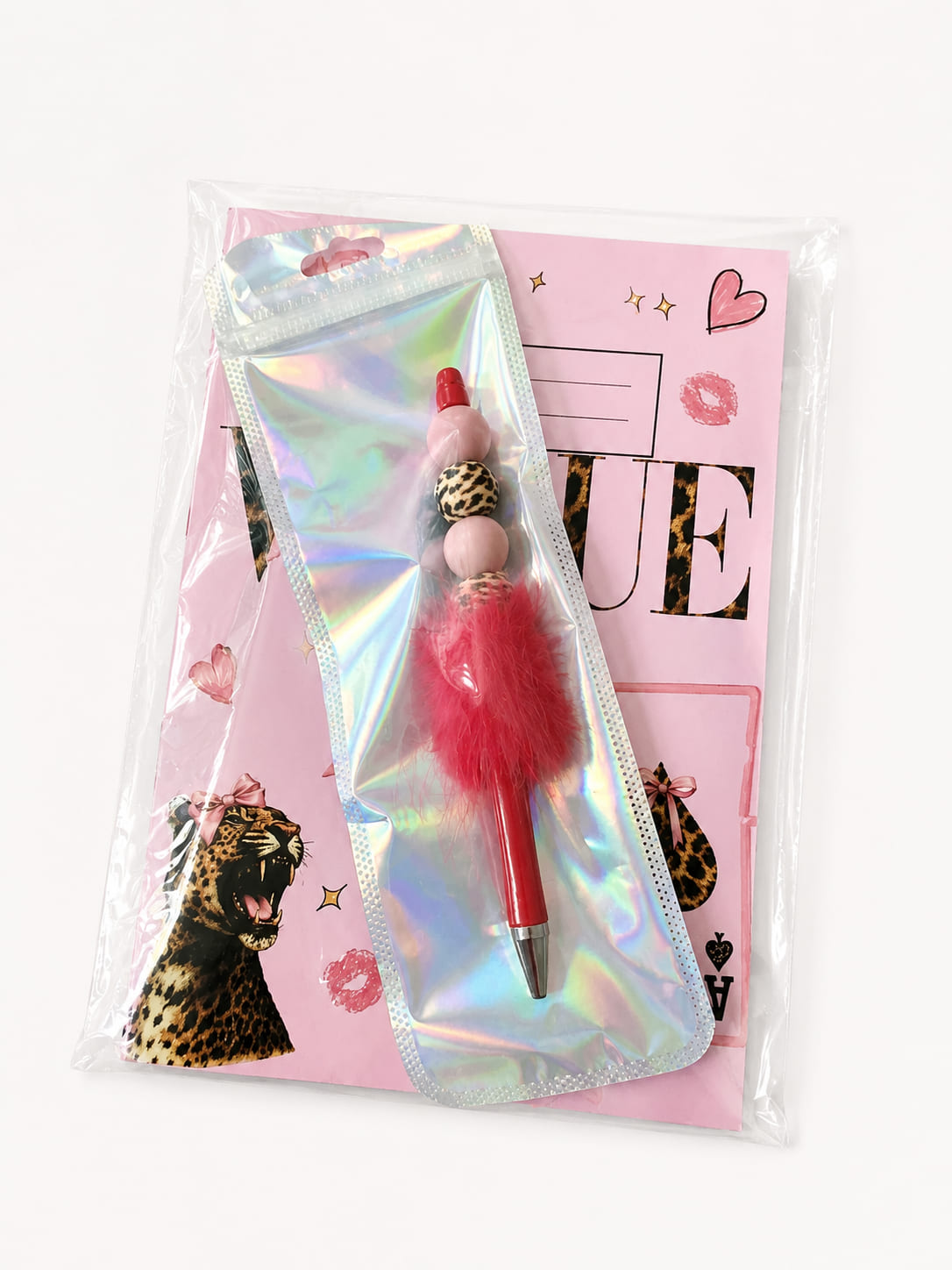 Pink leopard print notebook and fluffy beaded pen gift set with pen sealed in an iridescent holographic pouch