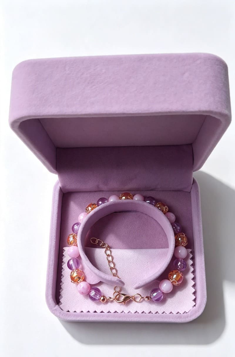 Handmade Violetta pastel bridal gemstone bracelet from Sparkling Resin Delights displayed inside an elegant open lilac velvet gift box on a white backdrop.
