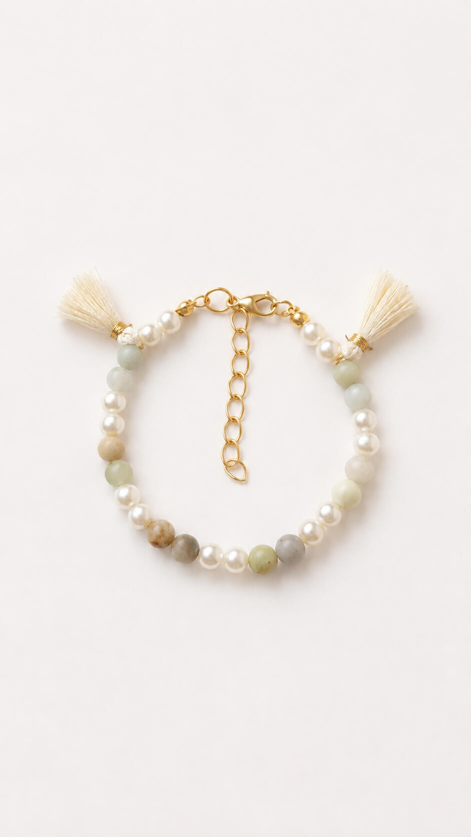 Handmade Pearl and Meadow bracelet with gemstone beads, faux pearls and cream tassels