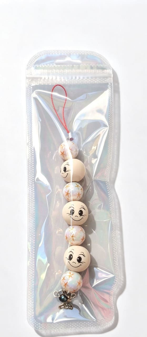 Handmade Sugarplum Pearl Angel beaded Christmas ornament presented in shimmering holographic resealable gift packaging