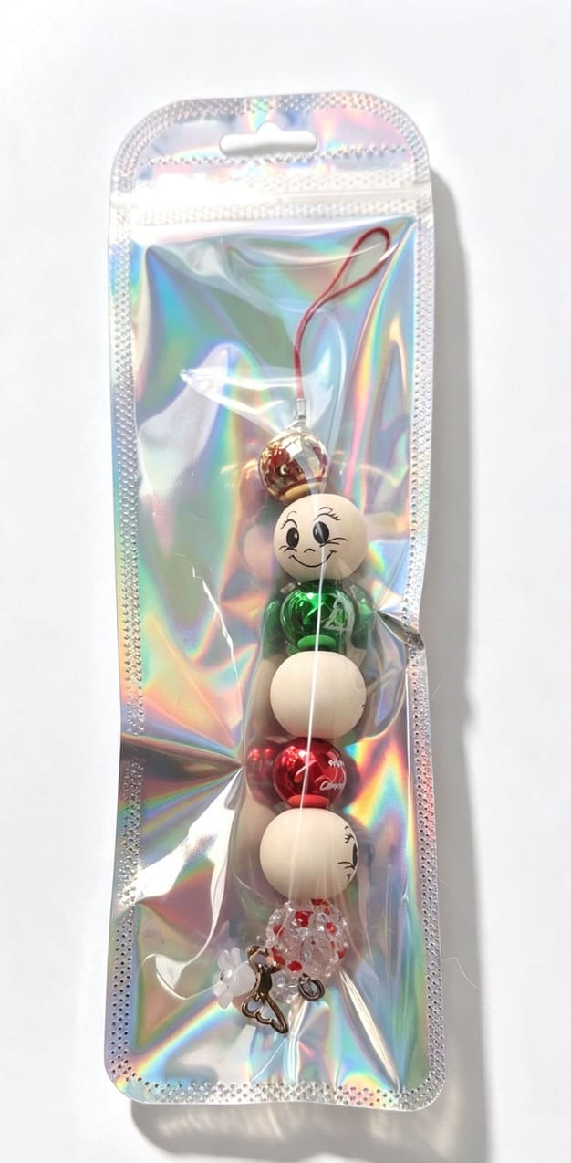 Handmade Festive Snowberry Angel beaded Christmas ornament presented in shimmering holographic resealable gift packaging