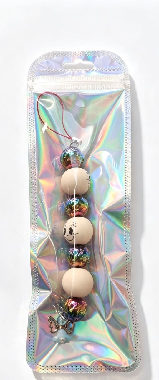 Handmade Holly Jolly Jingle Angel beaded Christmas ornament presented in shimmering holographic resealable gift packaging