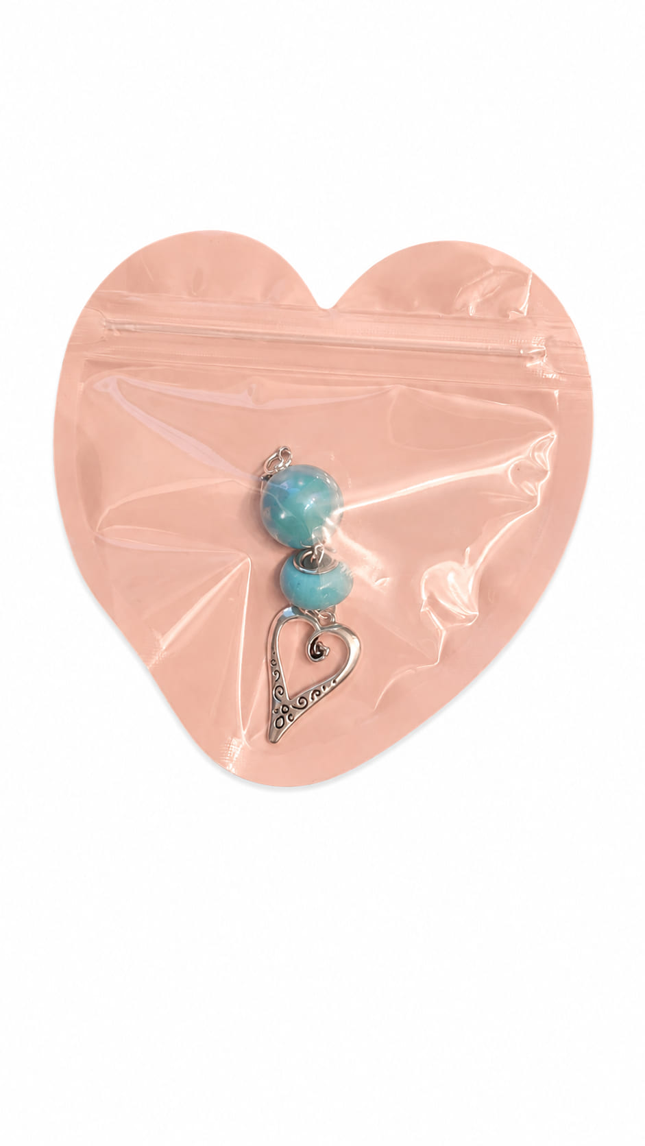 Individual handmade Something Blue bridal clip charms by Sparkling Resin Delights, each safely sealed flat inside its own signature pink heart-shaped boutique packaging pouch with a clear front window showcasing the unique beaded layout and antique silver