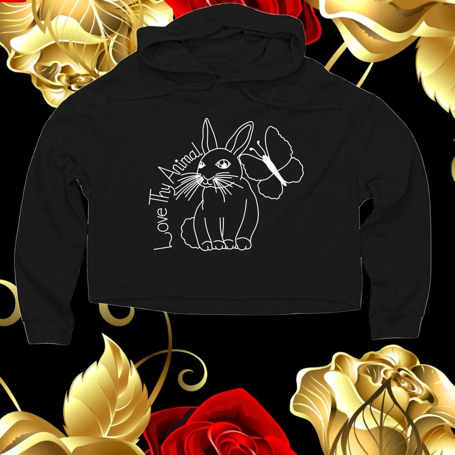 An image depicting a cropped black sweater with a bunny and butterfly graphic.