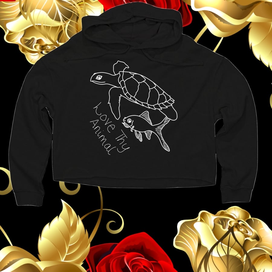 An image depicting a cropped black sweater with a turtle and fish graphic.