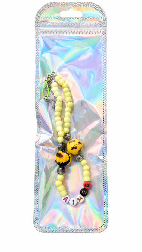 Personalised bumblebee and sunflower walking stick wrist loop with name beads presented in a holographic gift pouch