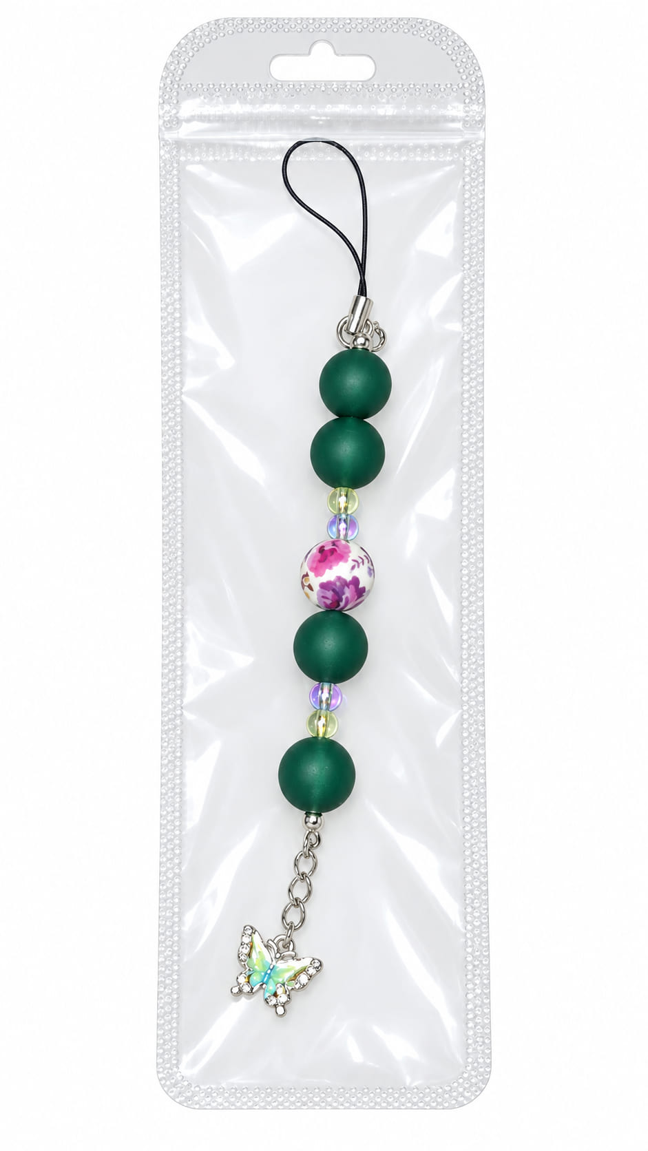 An emerald green silicone beaded phone charm with a floral center bead and a rhinestone butterfly dangle, displayed inside a clear, professional retail plastic pouch with a hanging tab.