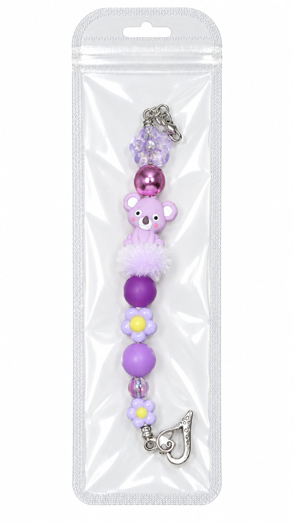 A cute purple koala silicone beaded fidget charm with a fuzzy lavender pom-pom, displayed inside a clear, professional retail plastic pouch with a hanging tab.