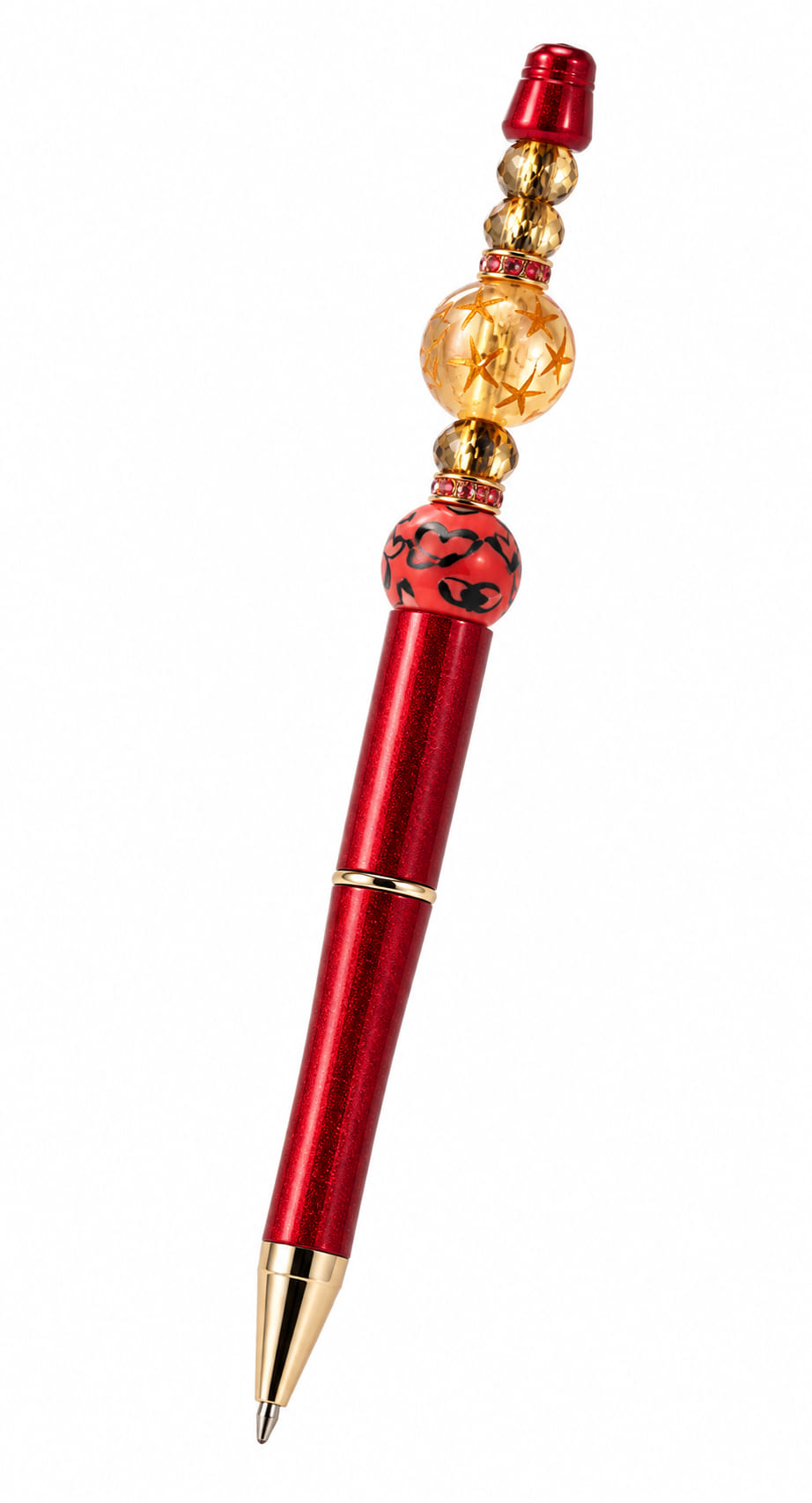 A close-up view of a custom metallic red ballpoint pen with gold trim, decorated with a red leopard print focal bead, faceted amber crystal spacers, and pink rhinestone column bands.
