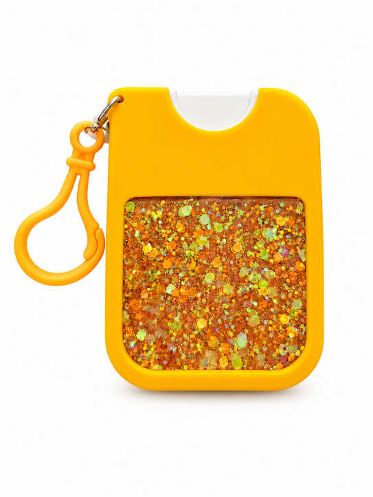 Back of orange hand cleaner keychain holder with orange and iridescent glitter resin panel