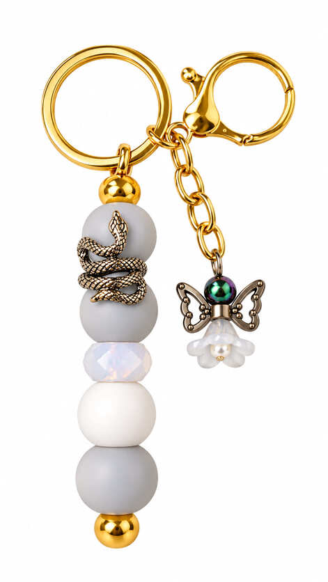 Handmade soft grey and white beaded keychain with silver-tone snake, angel charm and gold-tone clasp