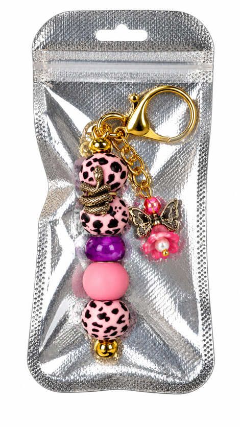 Handmade pink leopard print snake and angel bag charm presented in a shimmering silver gift pouch
