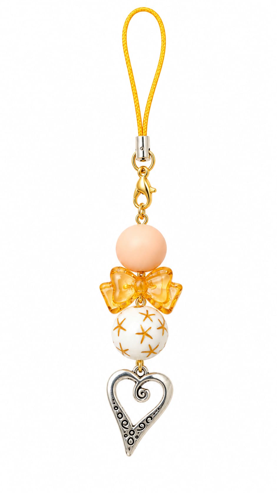 . The strap features a bright golden cord, a gold lobster clasp, a matte pastel peach round bead, a clear amber orange resin bow bead, a smooth white globe bead painted with tiny gold star bursts, and a stylized silver open-heart charm decorated with intr